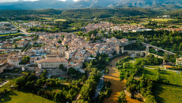 Aerial drone view of Besalu medieval town with historic bridge and mountains in Catalonia Spain