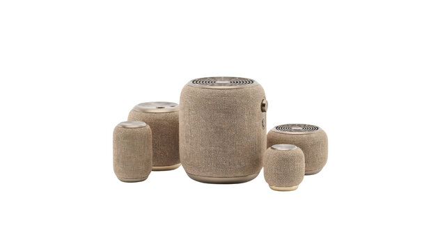Modern cylindrical wireless smart speakers with textured fabric housing and metallic accents arranged in a group for high quality audio performance isolated on transparent background