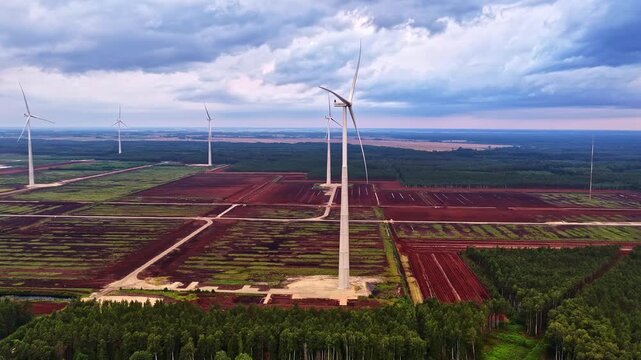 Aerial view of wind turbines installed in the Kaigu purvs peat bog landscape in Livberze parish, Jelgava Municipality, Latvia.