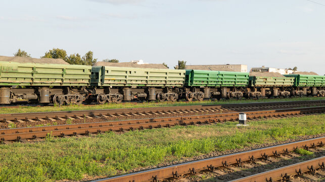 Open Freight Dump Cars on Railway Tracks at Industrial Yard