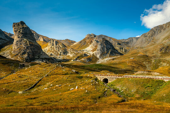 Mountains in autumn under blue sky on Italian-Swiss border.