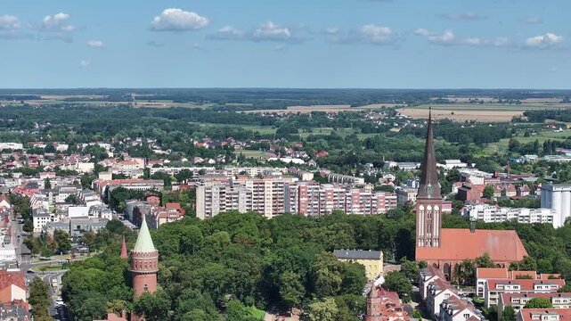 Stargard Poland church apartmentws city center parks pull. Northern Poland in 8th century. Historical stronghold, defensive walls, gates towers. WW II POW camp controlled by Germany. Brick church.