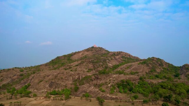 Aerial drone footage of Mandar Parvat in Banka, Bihar, showcasing the sacred hill, lush green landscape, surrounding countryside and historic pilgrimage site linked to Samudra Manthan.

