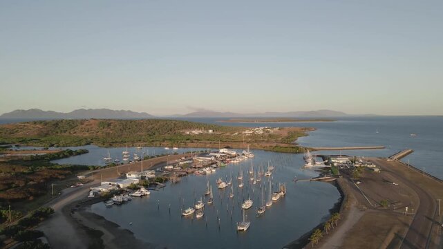 Aerial view of the marina filled with boats in the coastal town of Bowen, Queensland, Australia.