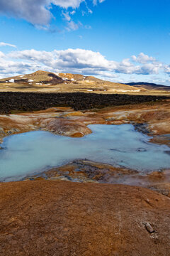 Vibrant Geothermal Hot Spring in Icelandic Volcanic Landscape