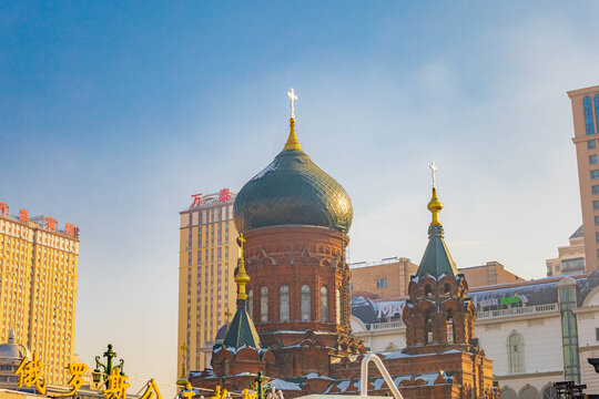 The iconic Saint Sophia Cathedral with colorful domes and red architecture in Harbin, China.