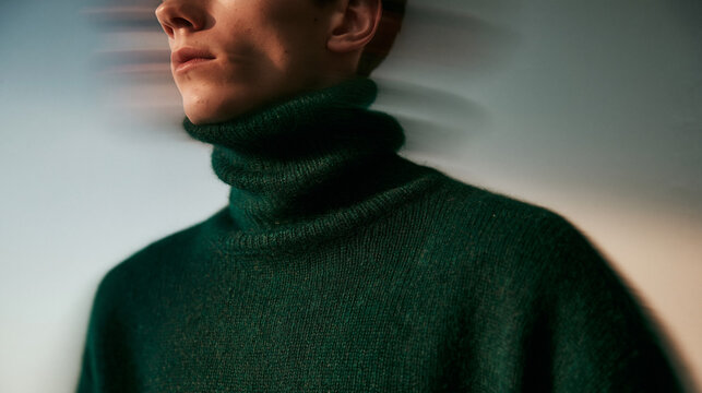 Young Man in Green Turtleneck Sweater with Motion Blur Effect