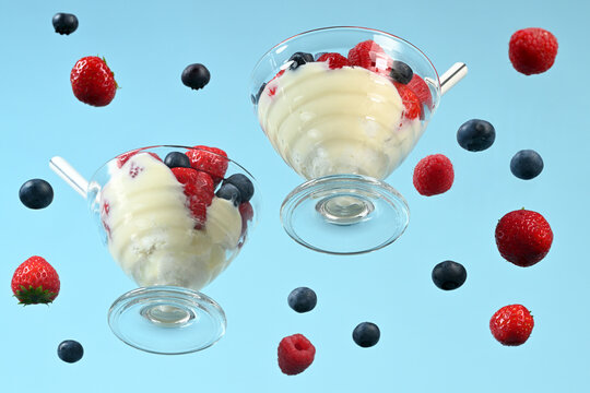 Glasses with yogurt and fresh berries