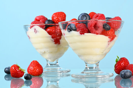Glasses with yogurt and fresh berries