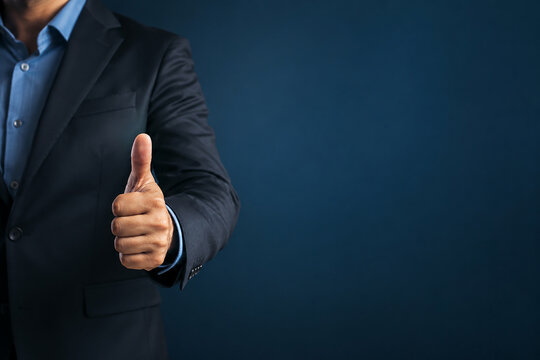 Hand of client show thumb up on blue background service rating, satisfaction concept.