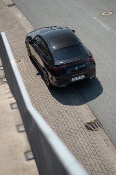 Wroclaw, Poland - August 4, 2026: Top-down rear view of a black Mercedes-Benz GLC 220d Coupe, highlighting its roofline and premium road presence.