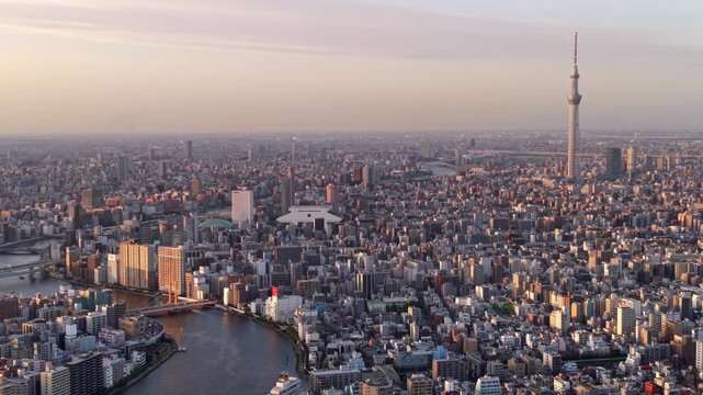 Aerial panning shot of the Sumida River and Tokyo cityscape, Sumida Ward, Central Tokyo, Japan. 
