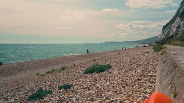 Dover, beach, sea, ocean, coastline, coast, shore, shoreline, seaside, people, walking, walkers, tourists, beachwalk, coastal, seaview, oceanview, waves, water, pebbles, pebblebeach, landscape, nature