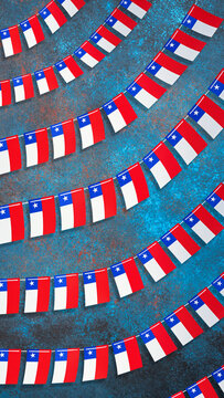 Chilean flags forming a festive garland on a blue background