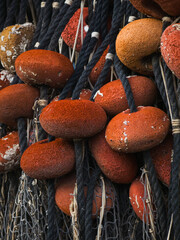 Weathered fishing net floats © Dorota