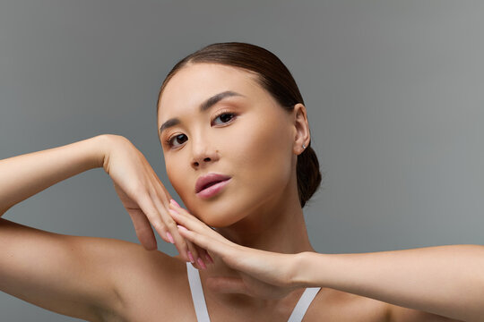 Sensual portrait of an Asian woman showcasing flawless beauty and elegance