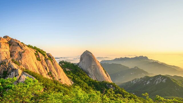 4K Time Lapse Video (Zoom out) of Sunrise at Bukhansan Mountain and Morning Sky with Beautiful Sea of Clouds at Bukhansan National Park, Seoul, South Korea.