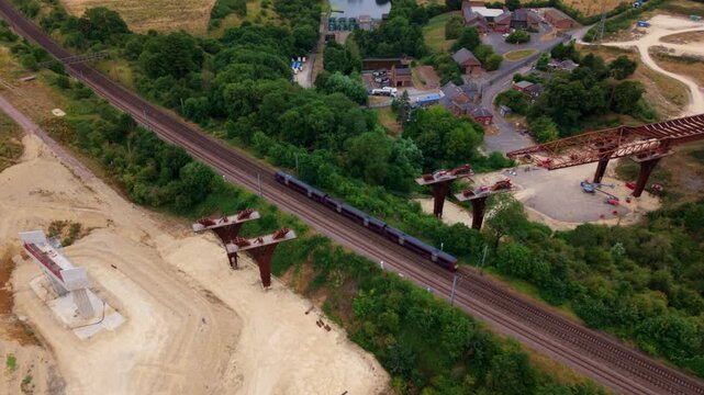Aerial view of the Southern bypass relief road bridge construction over railway tracks in Grantham, England, United Kingdom.