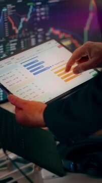 IT Project Management Roadmap Spreadsheet Tablet Process Stage Months Progress. Close-up view of a business analyst reviewing a digital tablet with Gantt chart milestones, project phases, and completi