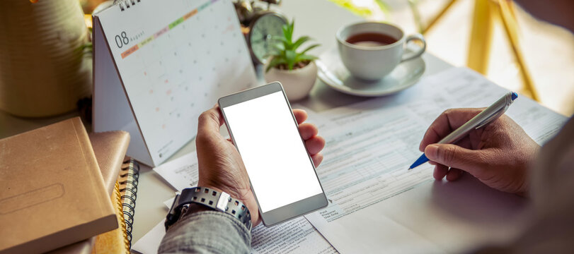Budget and Tax planning concept. Accountant hand using calculator and review tax forms. Represents personal finance, tax preparation, budgeting, and season to pay tax-banner image