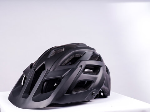 Black bicycle helmet on a white background