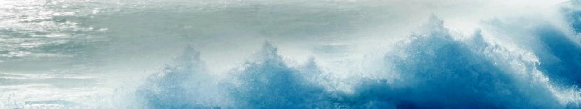 Widescreen Seamless Loop of Bright Blue Ocean Waves Breaking into White Sea Foam