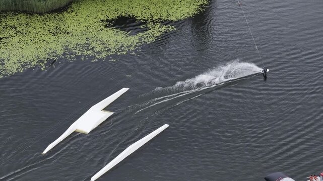 Aerial view of a person wakeboarding on a lake in Vilnius, Vilnius County, Lithuania.