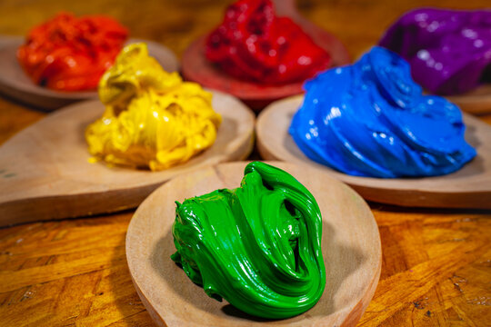 5Sticky plastisol ink on a wooden spatula, mixed to perfection, prepared for printing on fabrics. perfect for artists and printers aiming for bold, vibrant, long-lasting designs.
