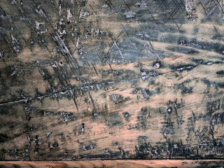Fototapeta premium Close‑Up of Weathered Wooden Surface with Scratches, Grain Patterns, and Aged Distressed Texture