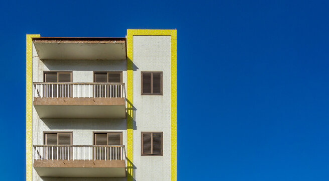 La Orotava building balconies with yellow trim and blue sky