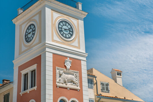 Historic clock tower with lion relief in Rovinj, Croatia.