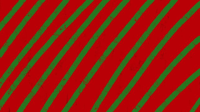 Abstract red and green hand drawn diagonal stripes moving seamless loop background for Christmas holiday