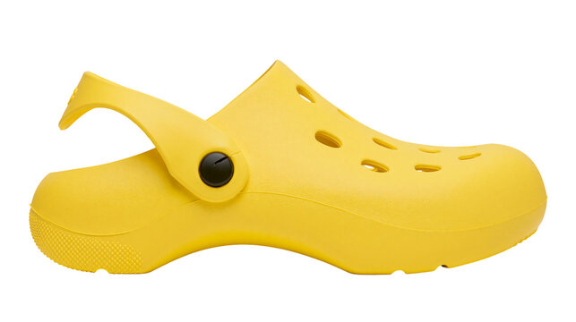 Bright yellow rubber clog shoe with pivoting heel strap, isolated on transparent background