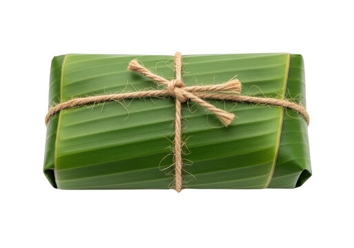 A bundle wrapped in green leaf and tied with twine isolated on transparent background