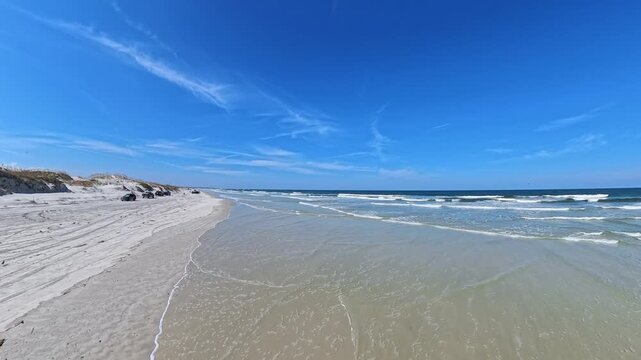 Wide Sandy Shoreline At Huguenot Memorial Park Near Jacksonville Florida Captured With Smooth Camera Motion
