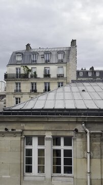 Elevated View of Classic Parisian Rooftops and Red Brick Architecture