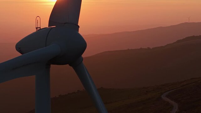 Wind turbine rotor close up at sunset