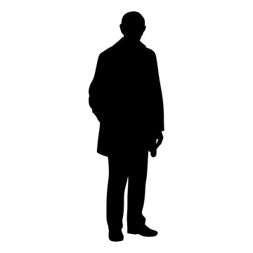 Silhouette of a man standing in an overcoat