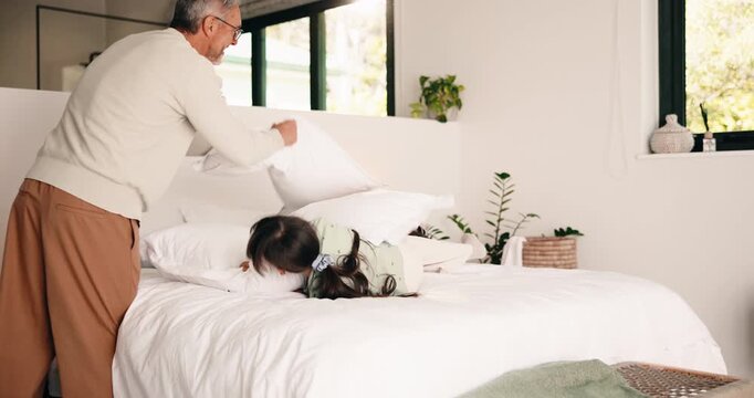 High five, bedroom and dad with children with pillow fight for bonding, playful fun and weekend. Family, happy and boy with girl on bed for laughing, energy and playing together in home with father
