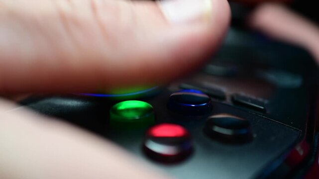 Close up of video game controller, used equipment macro detailed real time video, illuminated buttons, authentic real people activities, abstract close up.