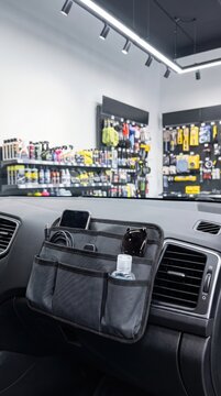 Dashboard storage organizer displayed in an automotive accessories store, vehicle organization, retail shopping, driving convenience.