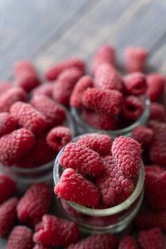 Fresh organic raspberries on wooden table background, food blogging, healthy eating concepts, and seasonal summer harvest themes. Small Farm food