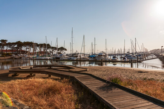Beautiful San Francisco Marina Yacht Harbor at sunrise with wooden boardwalk