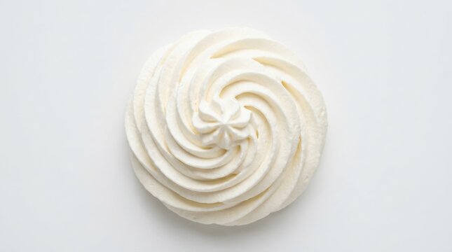 A swirl of whipped cream pipe topping isolated on a white background for food baking dessert and cake decoration use isolated on white background