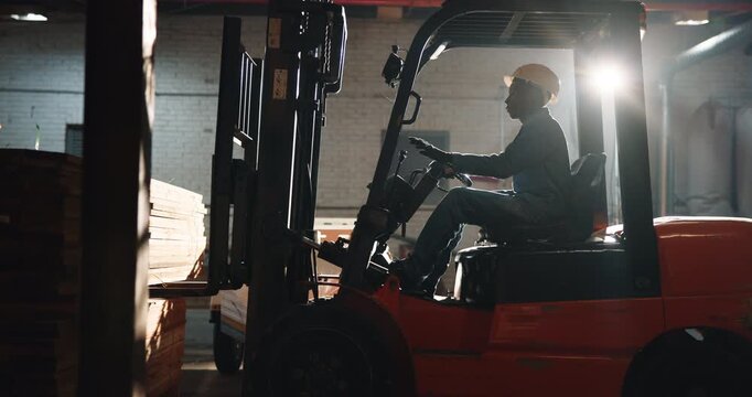 Forklift, wood and logistics with man in warehouse for manufacturing, cargo or shipping. Furniture production, stock transport and carpentry workshop with person in factory as driver for distribution