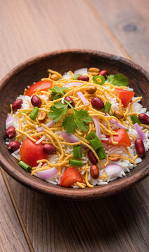 Traditional Indian Bhel Puri Street Food in Wooden Bowl 