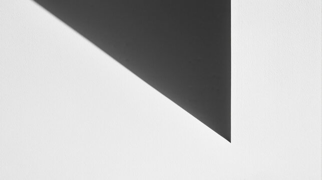 Abstract Minimalist Geometric Shadow on White Textured Wall