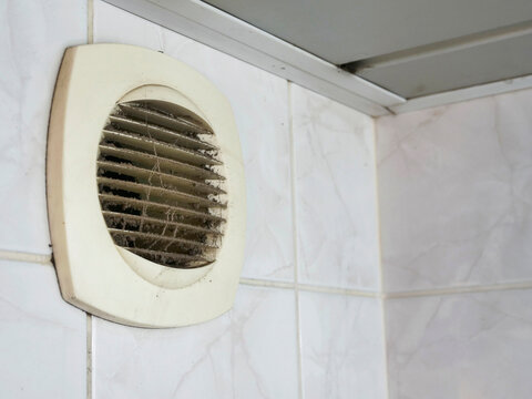 Dirty air vent with dust and cobwebs. Ventilation system needs cleaning. Grates covered in debris and filth. Dusty and neglected home or building feature. Not clean or maintained