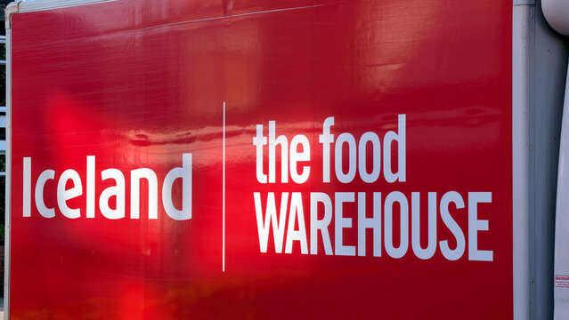 Leicester, England, UK - 30 July 2026: Iceland and The Food Warehouse branding, red delivery truck side