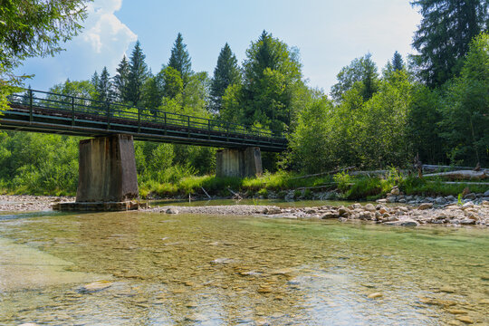 Old Railway Bridge Over the Clear Shallow Ammer River in Bavaria